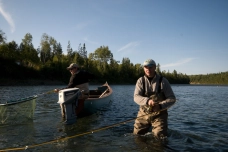 Man and fish over board Man and fish over board